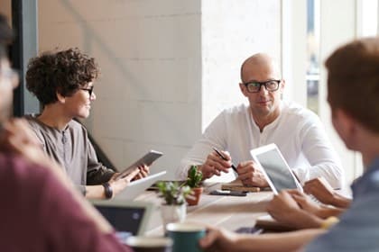 A marketing team working on a StoryBrand one-liner.